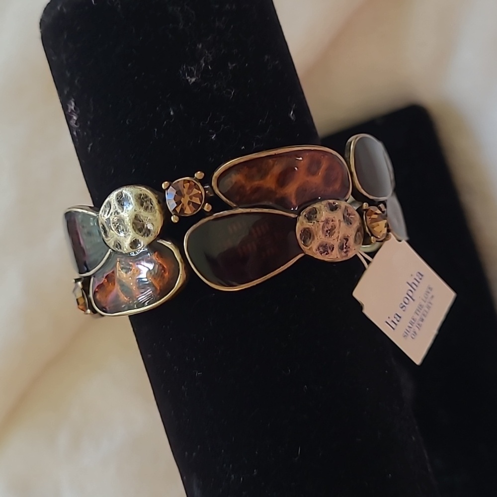 Lia Sophia Wild Thing stretch bracelet w/brass, black and brown tones.